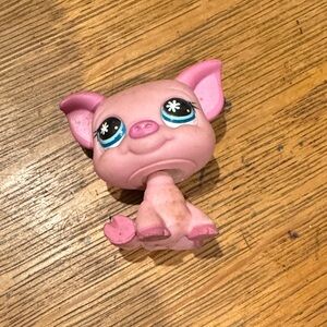 Pink Toy Figure with Blue Eyes